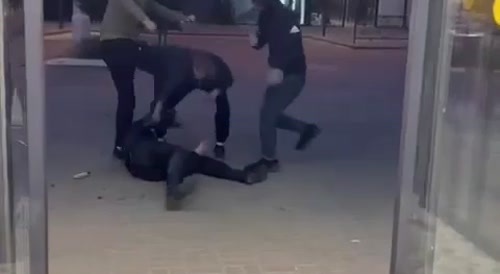 three people beat up a junkie in russia