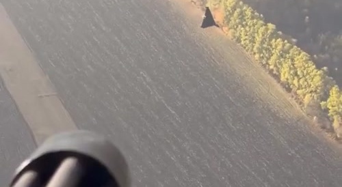 Ukrainian soldiers in a Mi-8 helicopter shoot down a Russian drone.