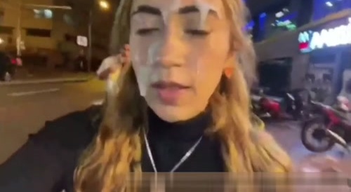 slut walks around in public with her face smeared with semen.