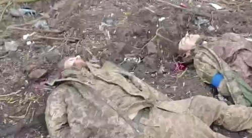 NKVD. Prisoners were shot with their hands tied behind their backs.