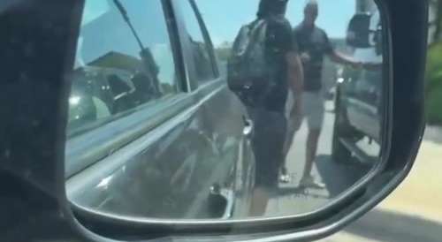 Someone breaks off side mirror and gets confronted.