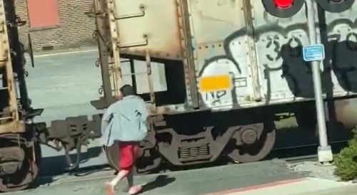 Guy almost gets run over by train