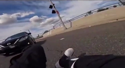 Biker hit while stopped