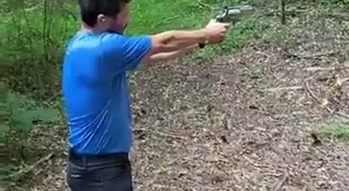 Guy almost shoots himself in the head