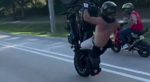 Biker crashes into SUV