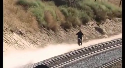Motocross rider eludes Police over railroad tracks