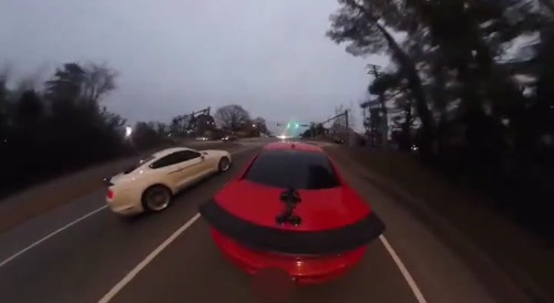 BMW driver loses control during drag race