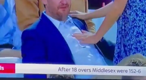 Guy eating some girls tit while on TV