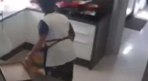 Clueless woman lits her hair on accident