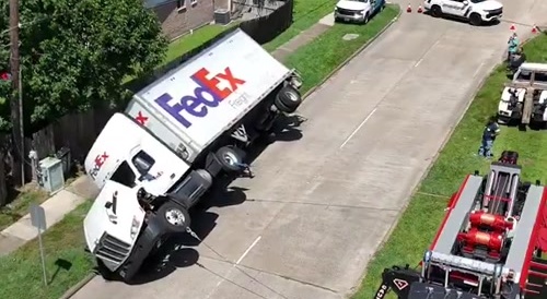 FedEx truck tips over and is recentered