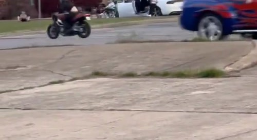 Motorcyclist hits lifted Pickup truck