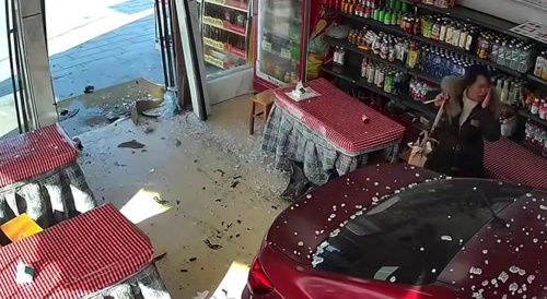 Chinese Woman Enters The Shop With Her Car
