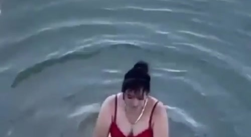 Asian woman has sex under an overpass.