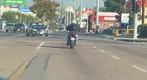Motorcyclist crashes while trying to beat red light