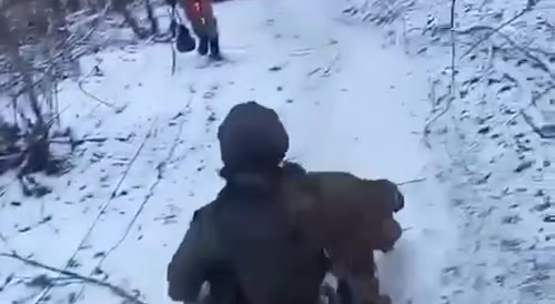 A North Korean soldier enjoys sledding on the frontline