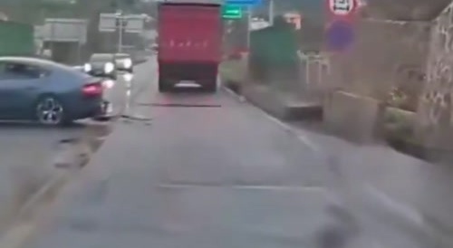 Car crashes on wet road
