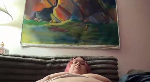 fat woman plays with her belly