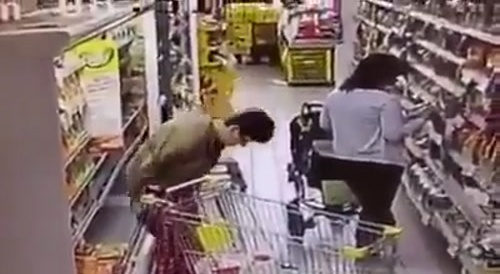 Woman defecates in the market.