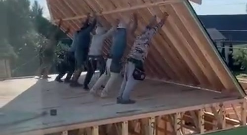 Workers mismanage a construction piece