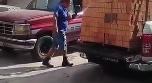 A thousand bricks fall from the pickup truck.