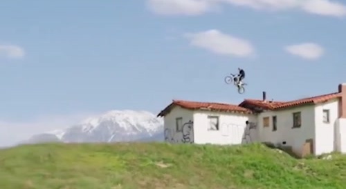 Biker attempts jumps and crashes