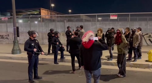 Fugly Tranny Rides Into LAPD Riot Control Cops