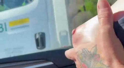 She showed her breasts to the driver.
