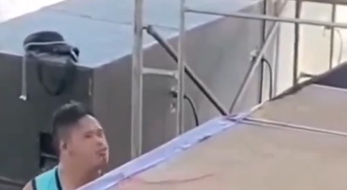 Bro having a good time by the stage