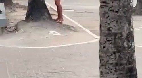 Naked Woman in Brazil Throwing Stones
