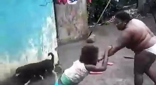 Big black woman swinging a machete