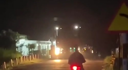 A truck hit by a train and split in half