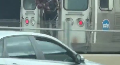 Guy dancing behind moving train