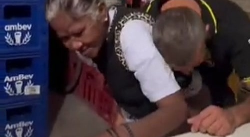 Man caught having sex with an old woman in a bar.