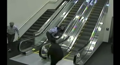Wheelchair Woman Falls down the Escalator