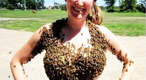 woman covered in bees