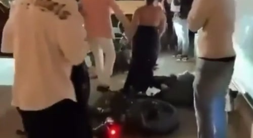 Woman runs over 2 people