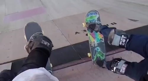 2 Skateboarders exchanging boards mid-air