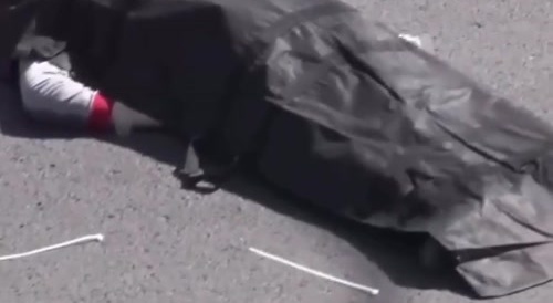 The man who fell while putting up a poster was crushed.