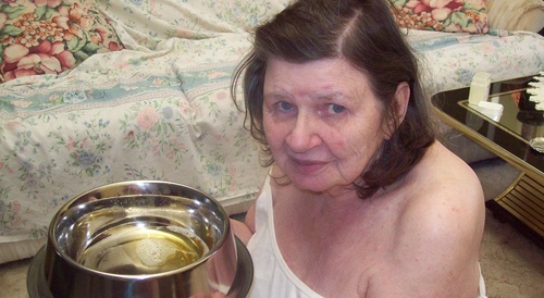 old woman drinks piss