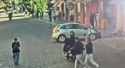 car drives through a crowd of people, different angle