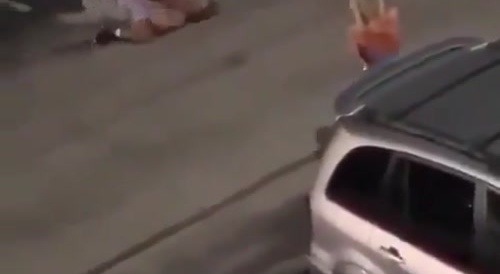 Black man hits white man and throws the woman to the ground.