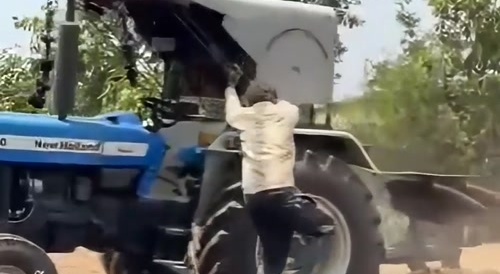 Another Indian Operating a Tractor