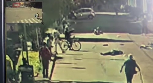 car drives through a crowd of people