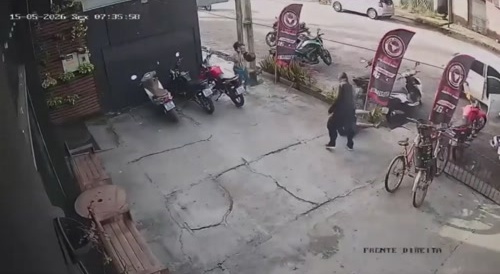 Hooded Assassin Patiently Waits for His Victim.