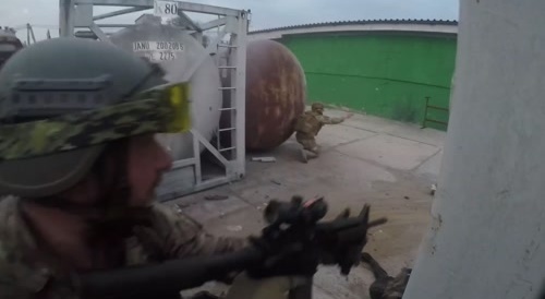 Dragging away dead Russian soldiers