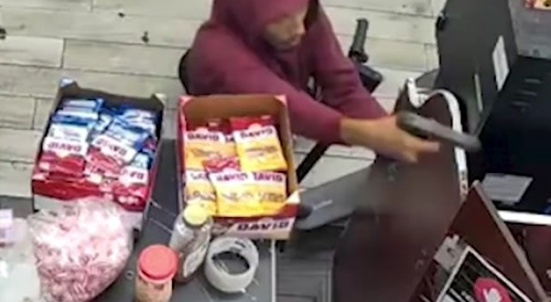 Robber Shoots Customer