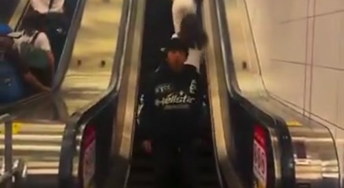 Stupid Idiot Gets 'Beech Slapped' on da Escalator