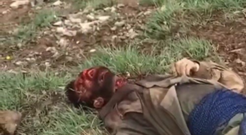 terrorist beheads with an axe