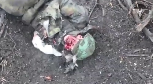 A russian soldier writhes in pain after a botched suicide attempt that blew off his face and arm.