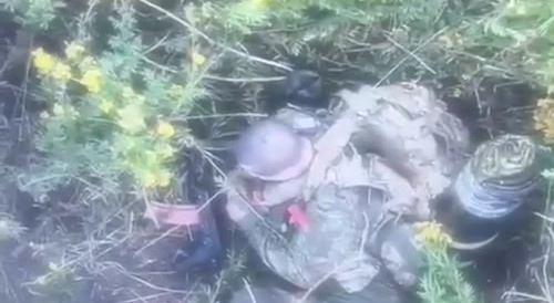 A russian soldier blows himself up with a grenade.